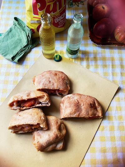 Rachel Roddy’s recipe for folded flatbreads with tomato, onion and cheese (scacce)