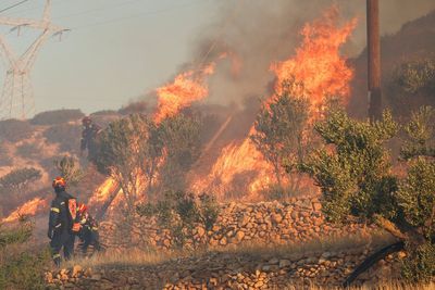 At least 1,500 evacuated as massive wildfire rips through Greek holiday island