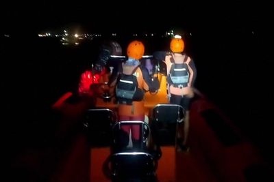 Rescue search underway after ferry sinks off coast of Bali with more than 60 people onboard