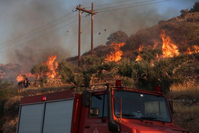 Thousands of tourists and homeowners forced to evacuate after wildfire rips through Crete