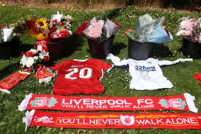 Liverpool fans leave flowers and tributes to Diogo Jota outside Anfield after death in car crash