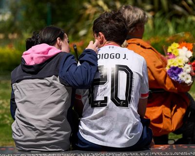 ‘Truly awful’: rival fans united in grief at Anfield after death of Diogo Jota