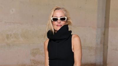 Gillian Anderson wears a striking black cowl-neck dress at the Jacquemus Paris fashion show – reminding us that an LBD never fails to impress
