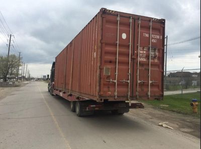 Truck Driver Faces Smuggling Charges After Over a Dozen Migrants Are Found Under Flatbed Trailer