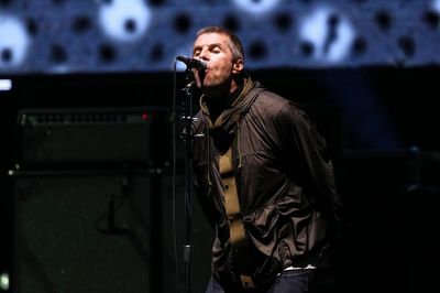'It's been too long': Gallagher brothers reunite as Oasis play first gig in 16 years
