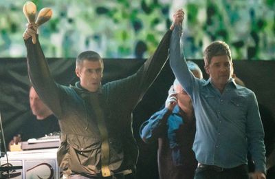 Oasis make triumphant return to the stage after 16 years away as Liam and Noel share a hug on stage