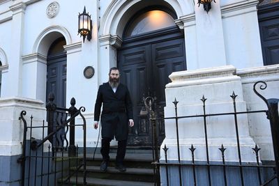 Congregation flees after arsonist sets fire to an Australian synagogue door