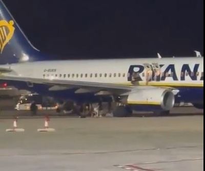 At least 18 injured as UK-bound Ryanair passengers leap onto wing after fire alert in Majorca