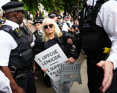 Met police arrest activists holding signs referring to Palestine Action