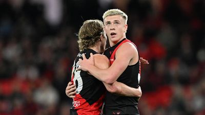 AFL clears Bombers star over huge umpire collision