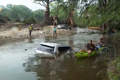 Families sift through debris and begin cleanup as Texas flood death toll rises
