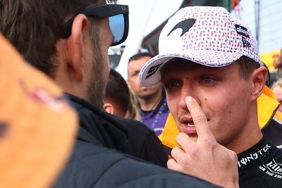 Lando Norris left with bloody nose after man falls off pit wall and lands on McLaren driver at British Grand Prix