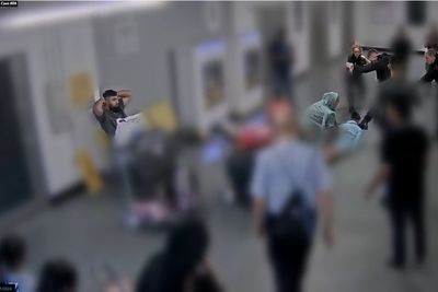 Footage of alleged attack on officers at Manchester Airport shown to jury