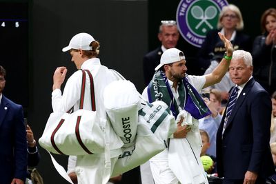 Jannik Sinner carries Grigor Dimitrov’s bags off court after heartbreaking retirement