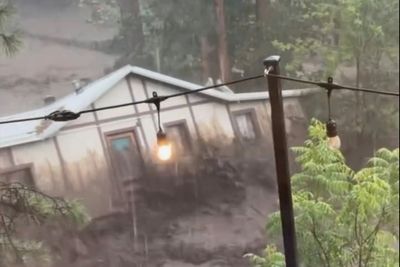 Three missing and house swept away as flash flooding hits New Mexico