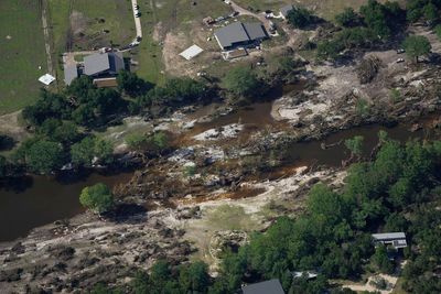 Searchers in helicopters and on horseback scour Texas flood debris for the missing