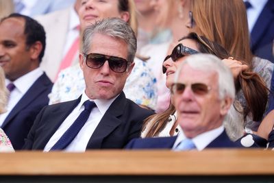 Hugh Grant and the Queen among famous faces in crowd during day 10 of Wimbledon