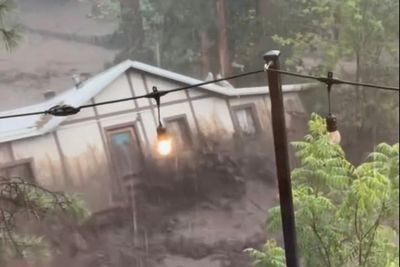 An entire house swept downstream in New Mexico floods seen as a symbol of the devastation