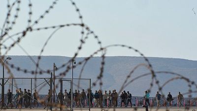 Hundreds of migrants moved from Crete to Greek mainland as arrivals from Libya surge