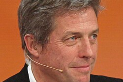 Hugh Grant Steals the Spotlight at Wimbledon 2025 with Effortless Charm and Classic Style