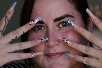 Cuban women embrace extravagant nail art despite economic hardships