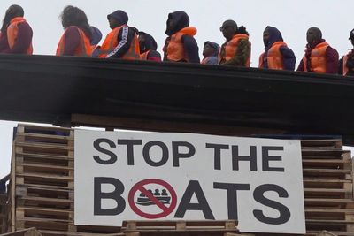 Anger after effigy of migrants in boat set on fire in Northern Ireland bonfire