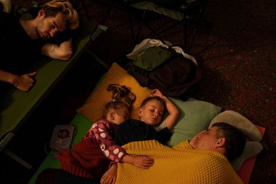 By day, the Ukrainian capital is alive and humming. By night, it’s a battleground