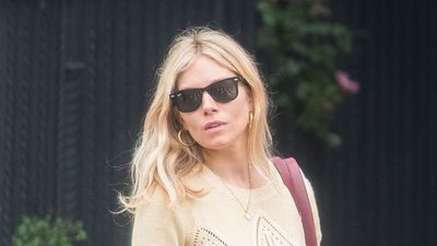 Sienna Miller's pointelle knit, wide leg trousers and Adidas trainers look is the butter yellow trend at its best