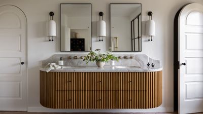 Should you choose your bathroom vanity mirror or lighting first? Designers share their advice for an easy design process