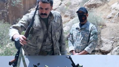 Erdogan rejoices as Kurdish PKK fighters destroy weapons at disarmament ceremony