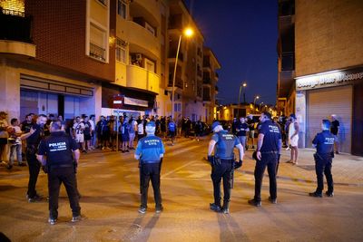 Police detain 8 people after anti-migrant clashes in Spanish town