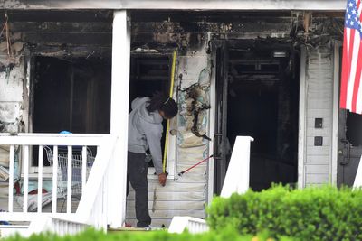 Nine dead and dozens injured after blaze at assisted living facility that left residents desperately hanging out of windows