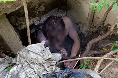 Naked American 'rescued' from condo drainage pipe