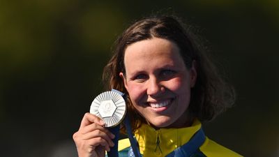 Johnson wins first Australian 10km world swim title
