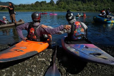 Native American teens kayak major US river to celebrate removal of dams and return of salmon