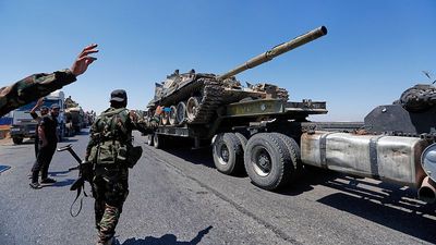 Dozens killed in sectarian violence and airstrike in southern Syria