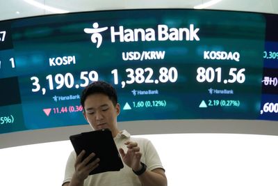 Asian shares are mixed after Nvidia nudges Nasdaq to a record, while other US stocks slump
