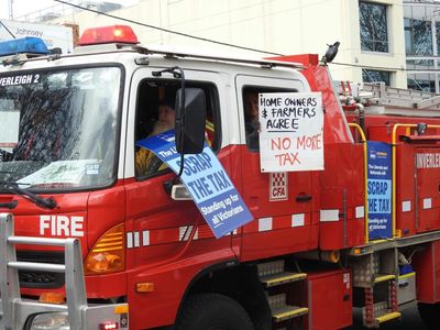 Firefighters warned of ‘dangers of partisan politics’ after truck displays Liberal corflutes at Melbourne protest