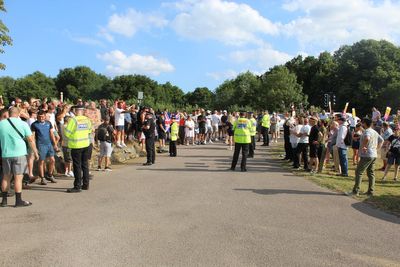 Police launch hate crime probe after security guard left bloodied during protest outside Epping migrant hotel