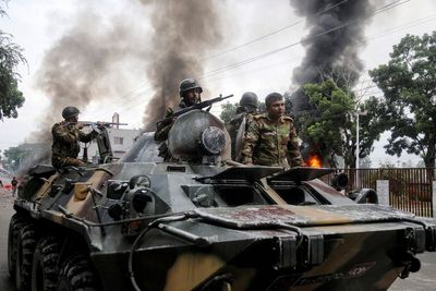 At least four dead after Bangladeshi forces clash with supporters of ousted leader