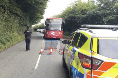 One child dead after coach carrying dozens of school pupils crashes in Somerset