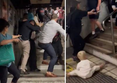 Moment baby left stranded on floor during vicious fight involving three men at London Tube station