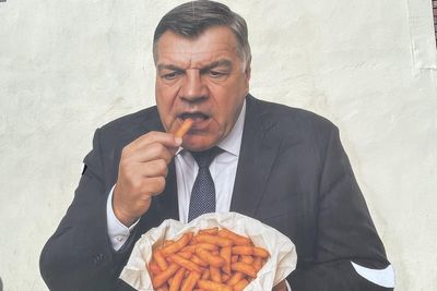 Mystery artwork of former England boss eating chips appears in town centre