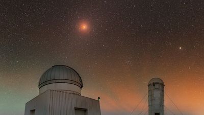 A lunar eclipse steals the show in a colorful sky | Space photo of the day for July 18, 2025