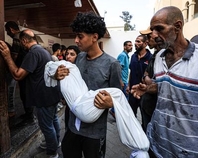 Dozens reported dead and more than 100 wounded after Israeli attacks on Gaza aid centres – as it happened