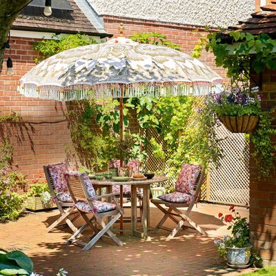 Inspired by English cottage gardens, this plot was transformed with planting, colour and comfy seating