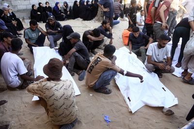 At least 32 Palestinians killed by Israeli gunfire near Gaza aid sites, say reports
