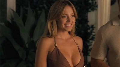 Sydney Sweeney Is Living Her Best Lake Life In A Black Swimsuit, But All I Can Think About Is Her Adorable Dog