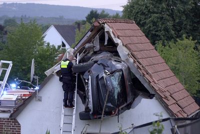 Car crashes into a barn's roof in Germany, seriously injuring 2