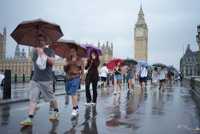 UK temperatures to turn warmer after heavy rain and thunderstorms cause yellow weather warnings